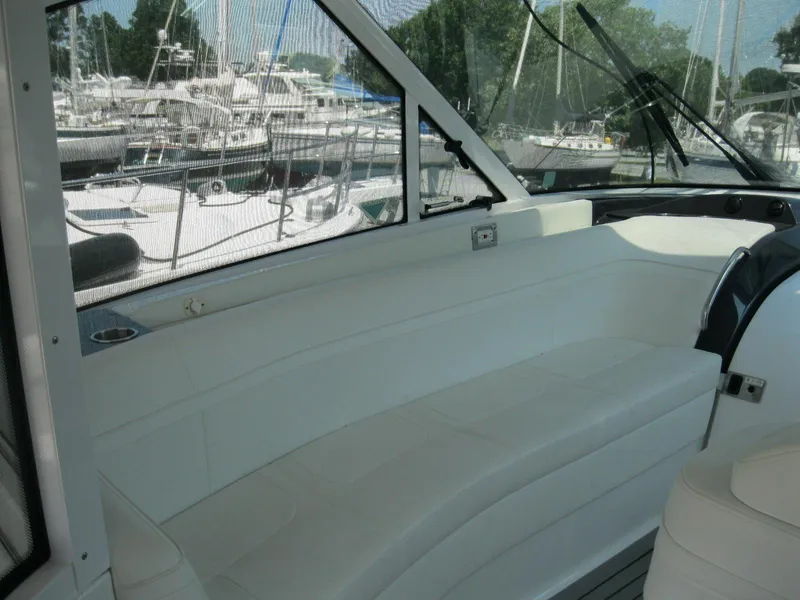 Slide: The Image of 2017 Formula 45 Yacht interior with white seating, docked at marina. - 24