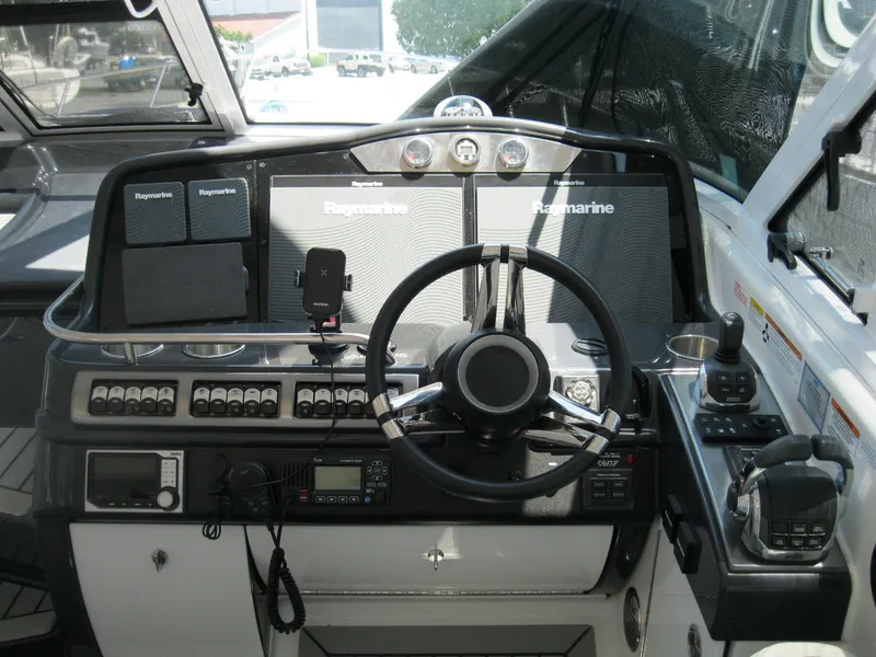 Slide: The Image of Cockpit of 2017 Formula 45 Yacht with Raymarine navigation systems and steering wheel. - 27