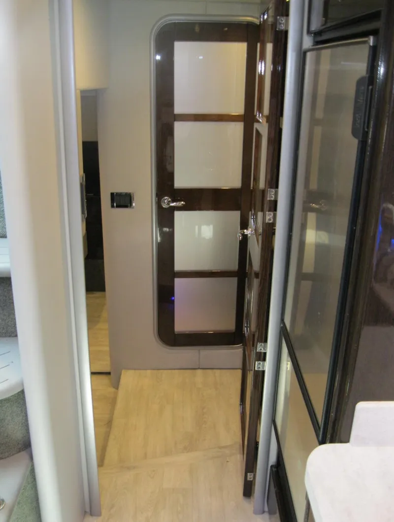 Slide: The Image of Interior hallway of a 2017 Formula 45 Yacht with modern design and wooden accents. - 48
