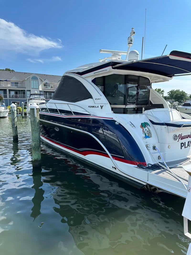 Slide: The Image of 2017 Formula 45 Yacht docked at marina, featuring sleek design and modern amenities. - 5