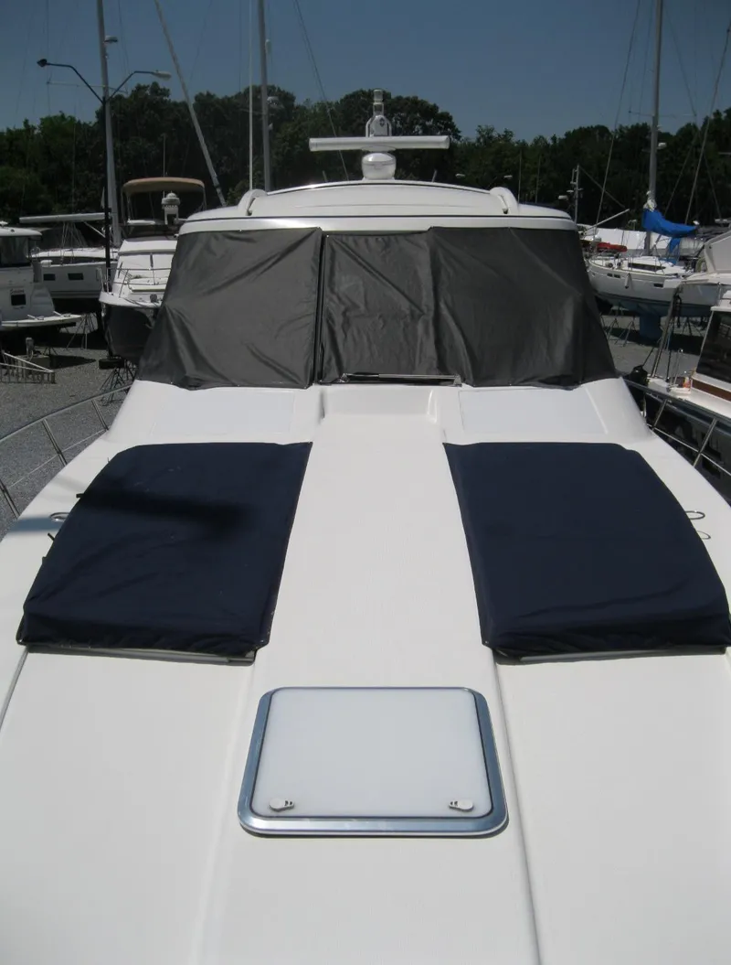 Slide: The Image of 2017 Formula 45 Yacht with sun pads and covered windshield in marina. - 7