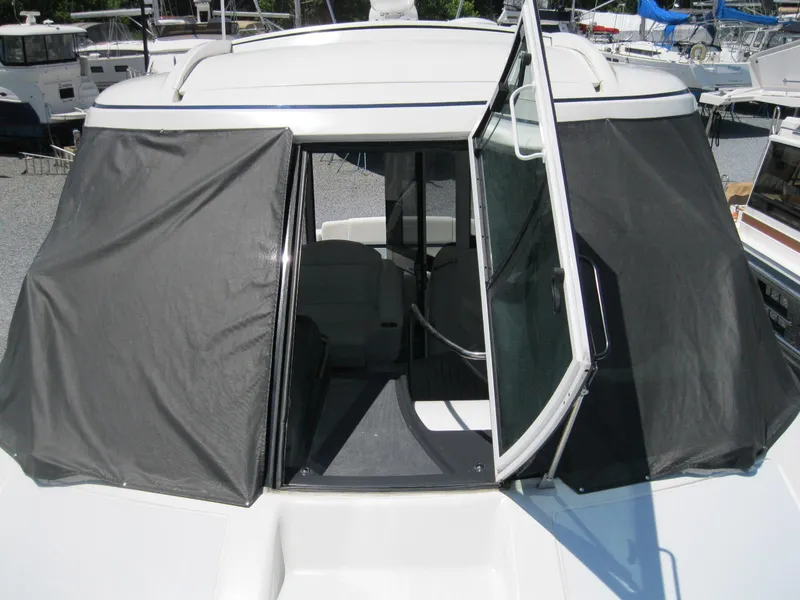 Slide: The Image of 2017 Formula 45 Yacht with open cabin door and black canvas covers. - 8