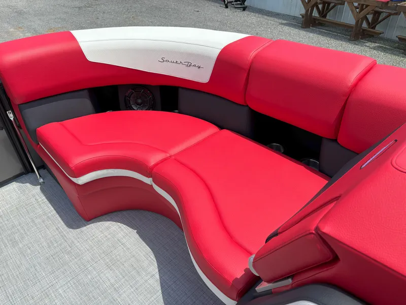 Slide: The Image of Red and white seating on 2026 South Bay 523 RS-DC boat, featuring modern design and comfort. - 10