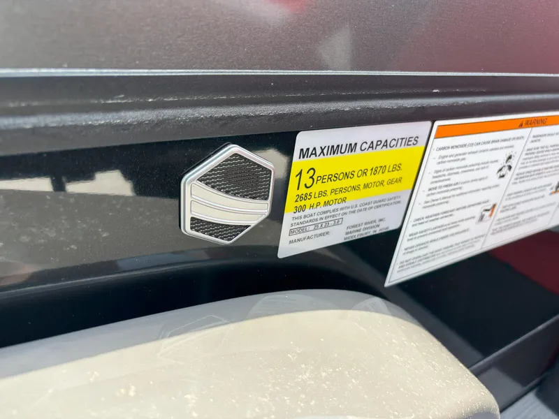 Slide: The Image of 2026 South Bay 523 RS-DC boat capacity label, 13 persons or 1870 lbs, 300 HP motor. - 12