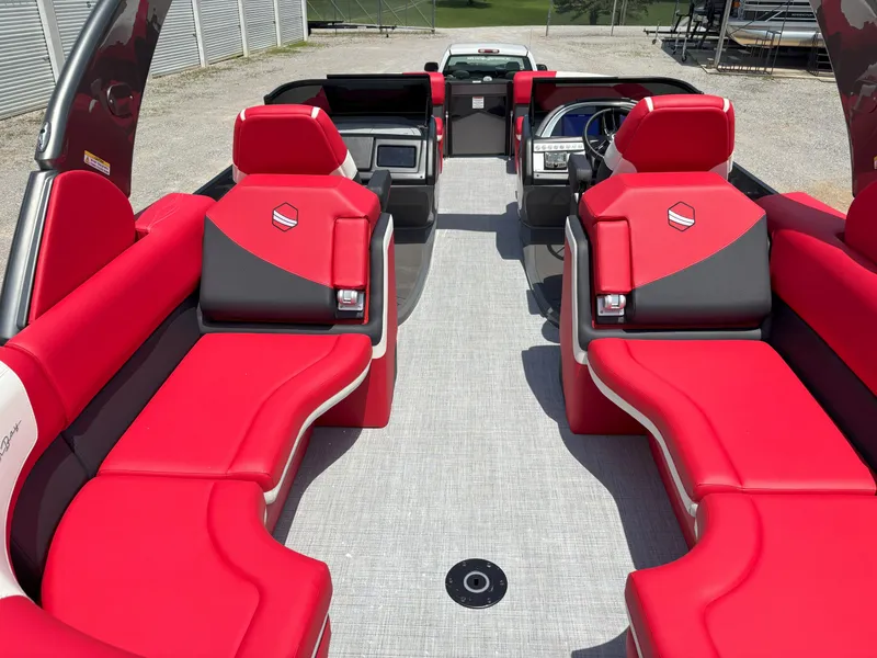Slide: The Image of 2026 South Bay 523 RS-DC boat interior with vibrant red seating and modern design. - 6