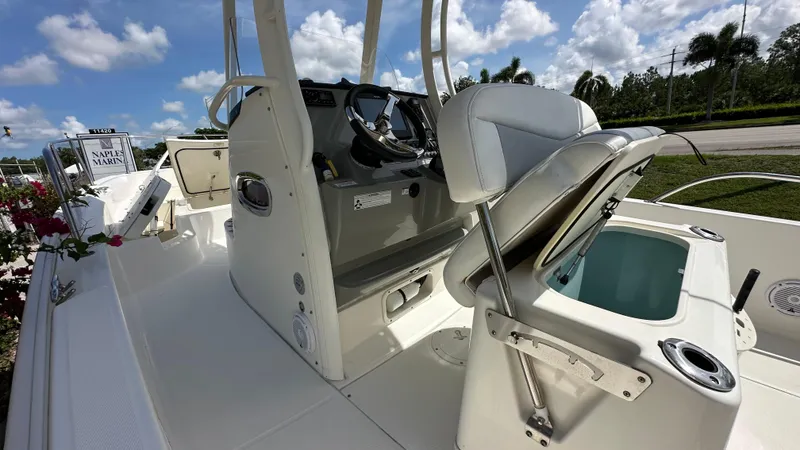 Slide: The Image of 2016 Boston Whaler 240 Dauntless boat interior with helm and seating. - 11