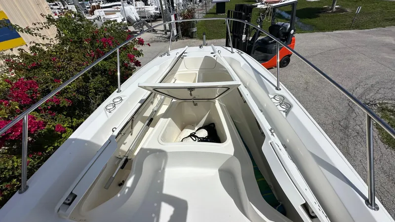 Slide: The Image of 2016 Boston Whaler 240 Dauntless boat deck with open storage compartment. - 6