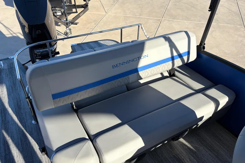Slide: The Image of 2026 Bennington 26 MSB boat seating with gray upholstery and blue accents. - 11