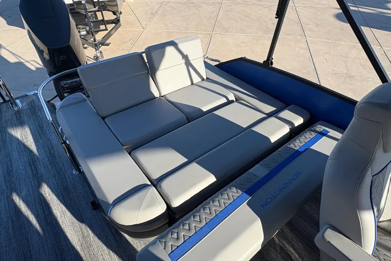 Slide: The Image of 2026 Bennington 26 MSB boat interior with luxurious gray seating and modern design. - 12