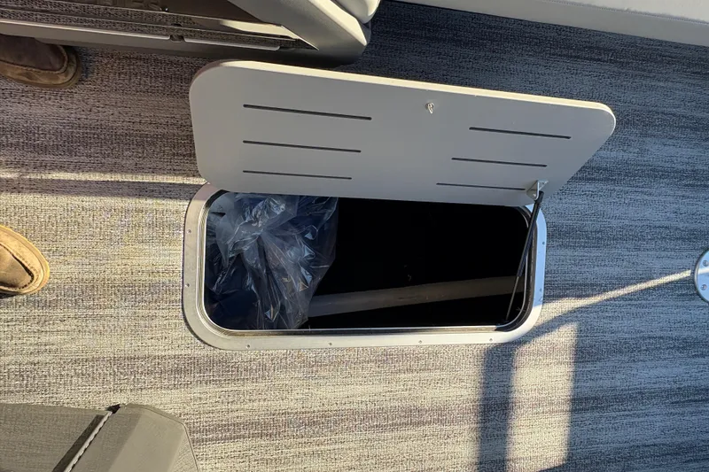 Slide: The Image of Open storage compartment on 2026 Bennington 26 MSB boat floor. - 3