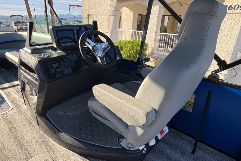 Slide: The Image of 2026 Bennington 26 MSB boat interior with modern helm and comfortable captain's chair. - 9