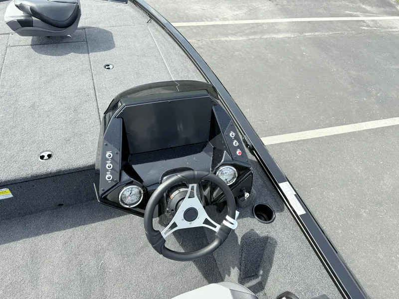 Slide: The Image of 2025 Crestliner XF 189 boat dashboard with steering wheel and control panel. - 6