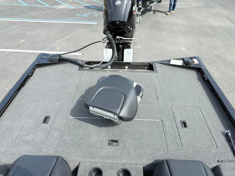Slide: The Image of 2025 Crestliner XF 189 boat deck with seating and motor in parking lot. - 9