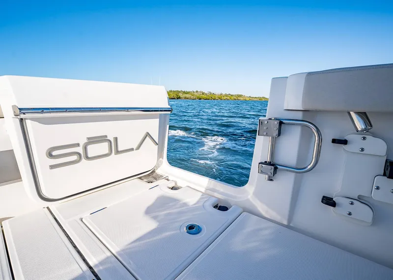 Slide: The Image of 2025 Solace 30 CS boat deck with ocean view and clear blue sky. - 10