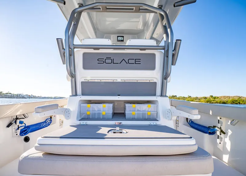 Slide: The Image of 2025 Solace 30 CS boat interior with storage compartments and seating. - 20