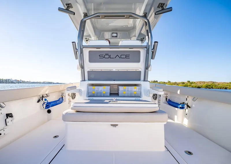 Slide: The Image of 2025 Solace 30 CS boat interior with seating and storage, featuring sleek design and modern amenities. - 21