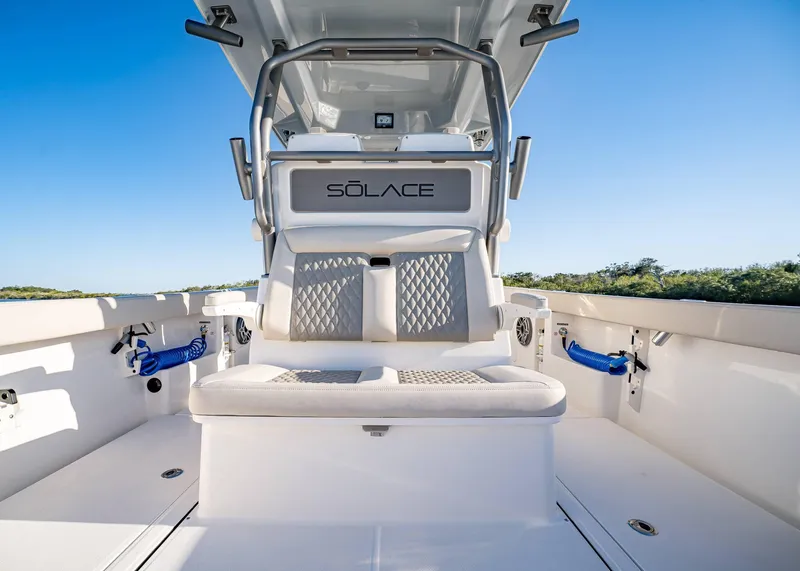Slide: The Image of 2025 Solace 30 CS boat interior with cushioned seating and sleek design. - 23