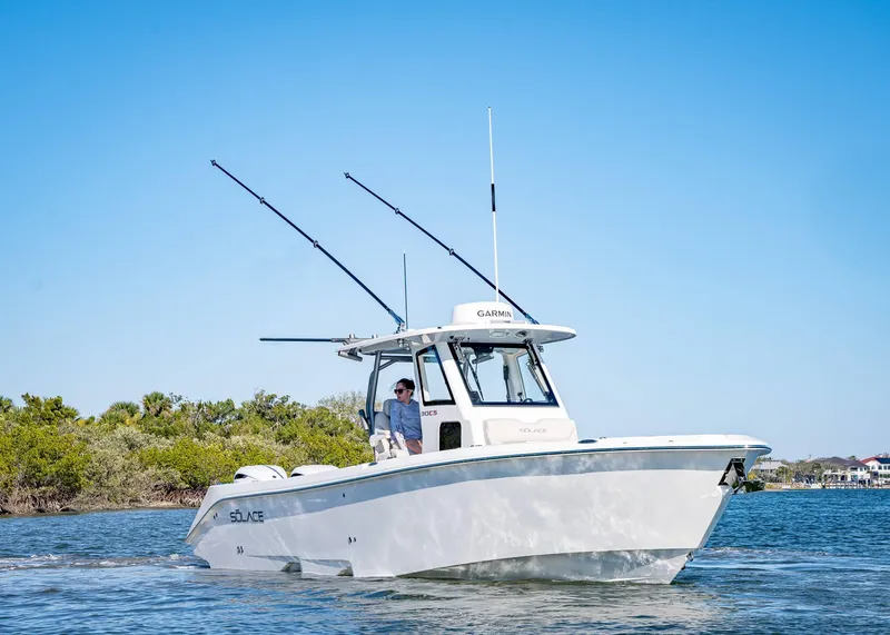 Slide: The Image of 2025 Solace 30 CS boat cruising on a sunny day, featuring sleek design and advanced technology. - 3