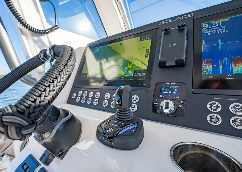 Slide: The Image of Control panel of 2025 Solace 30 CS boat with advanced navigation displays. - 30