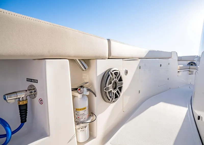 Slide: The Image of 2025 Solace 30 CS boat interior with fresh water access and speaker system. - 35