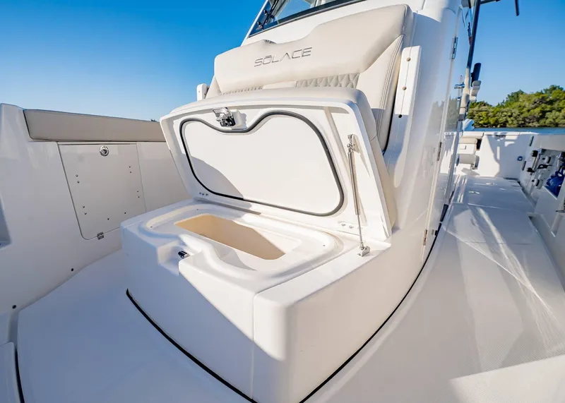 Slide: The Image of 2025 Solace 30 CS boat with open storage compartment on deck. - 38