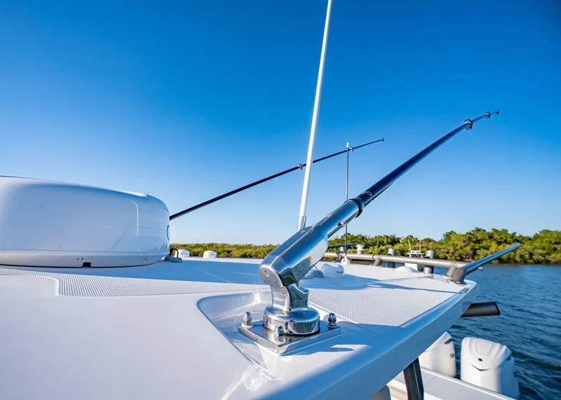 Slide: The Image of 2025 Solace 30 CS boat with fishing rods on a sunny day. - 41