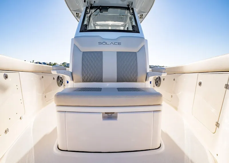Slide: The Image of 2025 Solace 30 CS boat interior with cushioned seating and sleek design. - 42