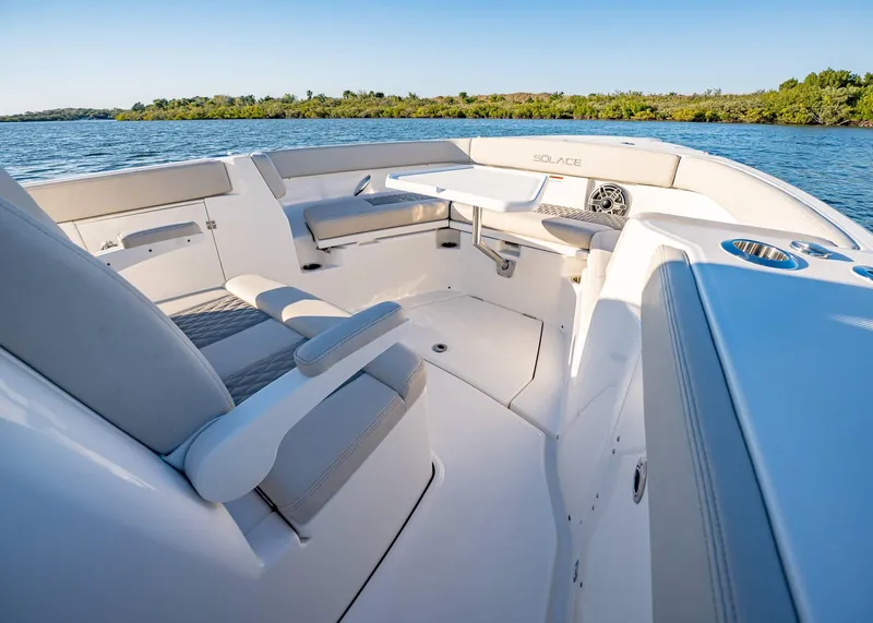 Slide: The Image of Luxurious interior of 2025 Solace 30 CS boat with comfortable seating and scenic water view. - 45