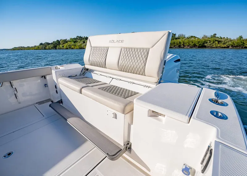 Slide: The Image of 2025 Solace 30 CS boat interior with luxurious seating and scenic water view. - 7