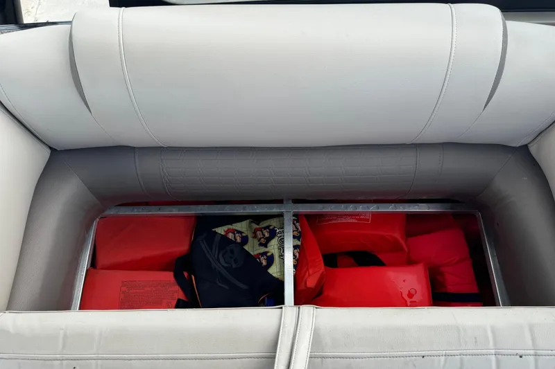 Slide: The Image of Storage compartment in 2017 Tahoe Pontoon Cascade Platinum 2785EL with life jackets and gear. - 14