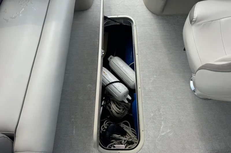 Slide: The Image of Storage compartment on 2017 Tahoe Pontoon Cascade Platinum 2785EL with ropes and fenders. - 18