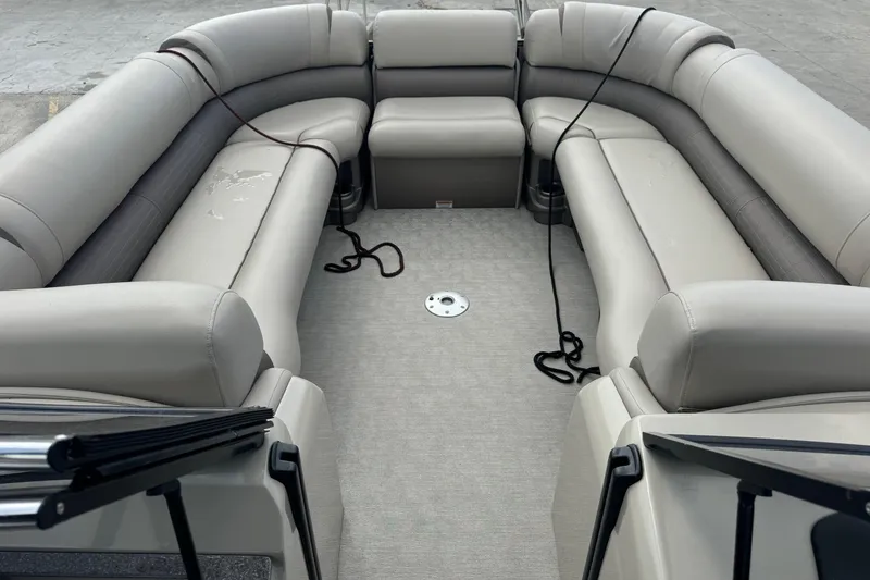 Slide: The Image of 2017 Tahoe Pontoon Cascade Platinum 2785EL interior with beige seating and clean deck. - 19