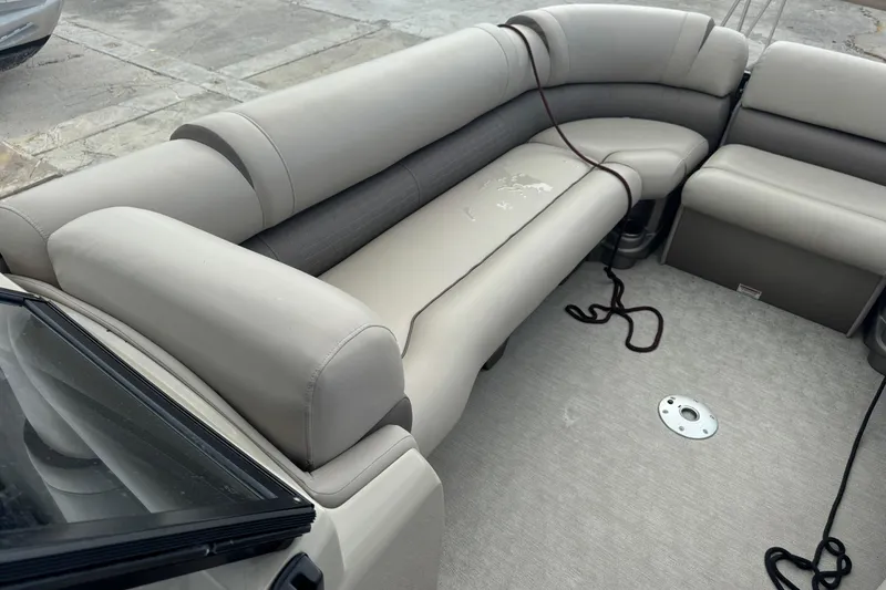 Slide: The Image of 2017 Tahoe Pontoon Cascade Platinum 2785EL interior with beige seating and carpeted floor. - 20