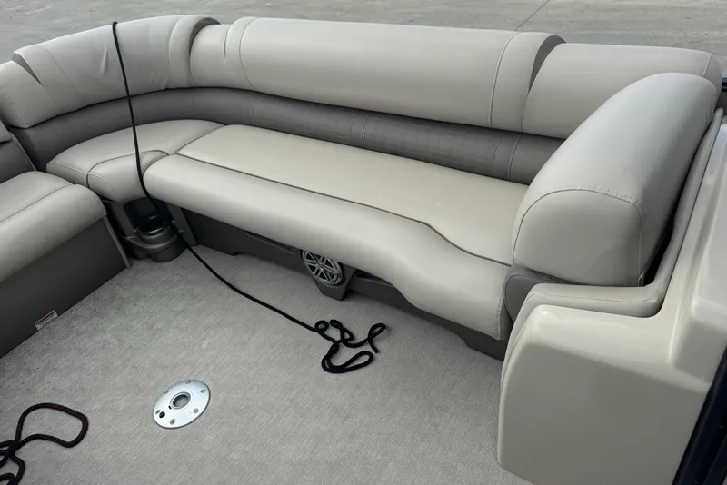 Slide: The Image of 2017 Tahoe Pontoon Cascade Platinum 2785EL interior with beige seating and floor details. - 21