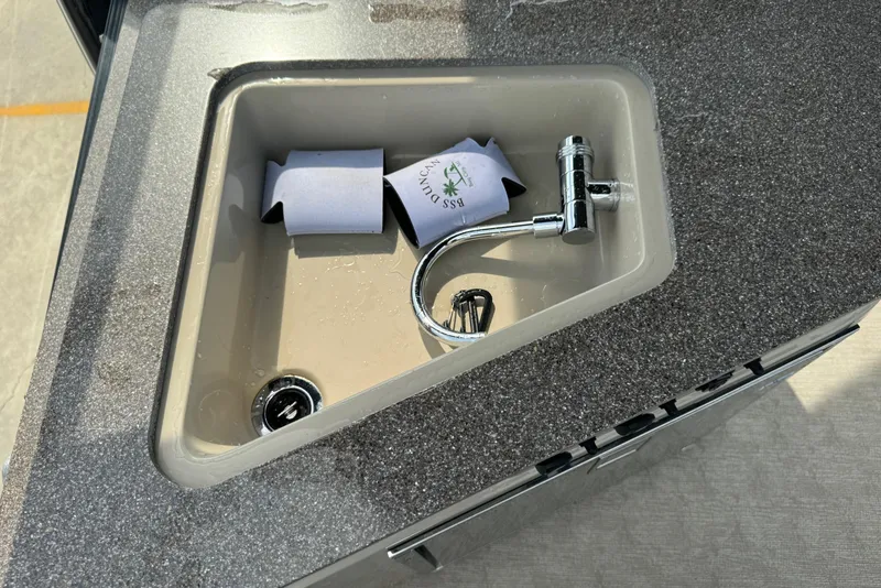 Slide: The Image of Sink with faucet on 2017 Tahoe Pontoon Cascade Platinum 2785EL boat. - 7