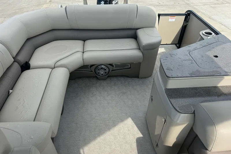 Slide: The Image of 2017 Tahoe Pontoon Cascade Platinum 2785EL interior with gray seating and wet surfaces. - 9