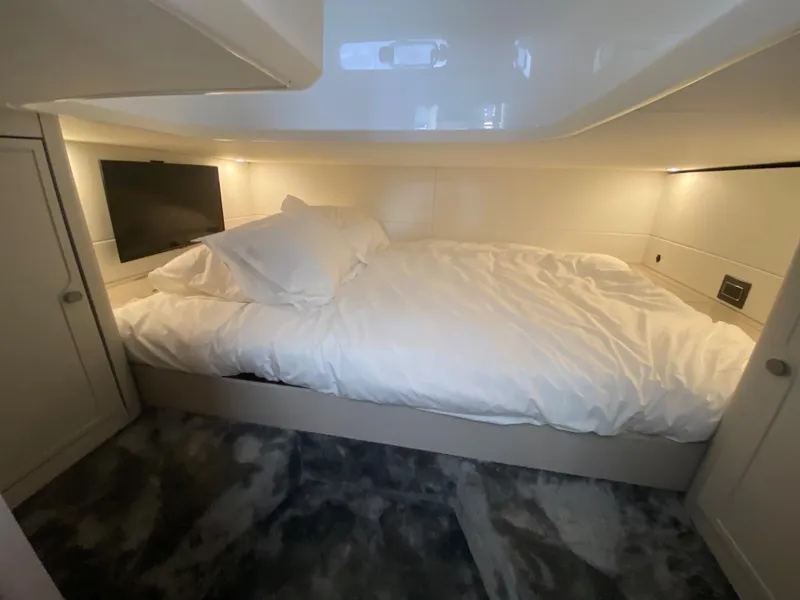 Slide: The Image of Luxurious cabin interior of 2022 Fairline F//Line 33 yacht with cozy bed and TV. - 14