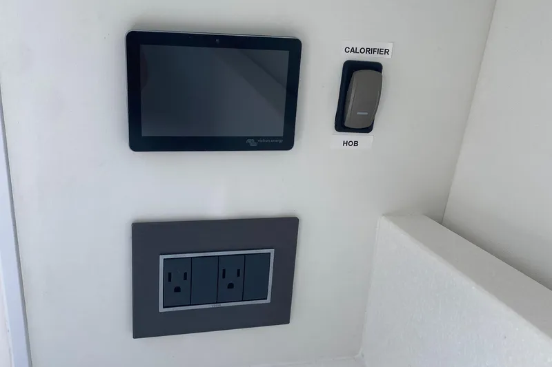 Slide: The Image of Control panel and outlets on 2022 Fairline F//Line 33 yacht interior. - 19