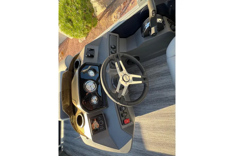 Slide: The Image of Steering console of 2026 Bennington 21 SSR boat with modern controls and gauges. - 9