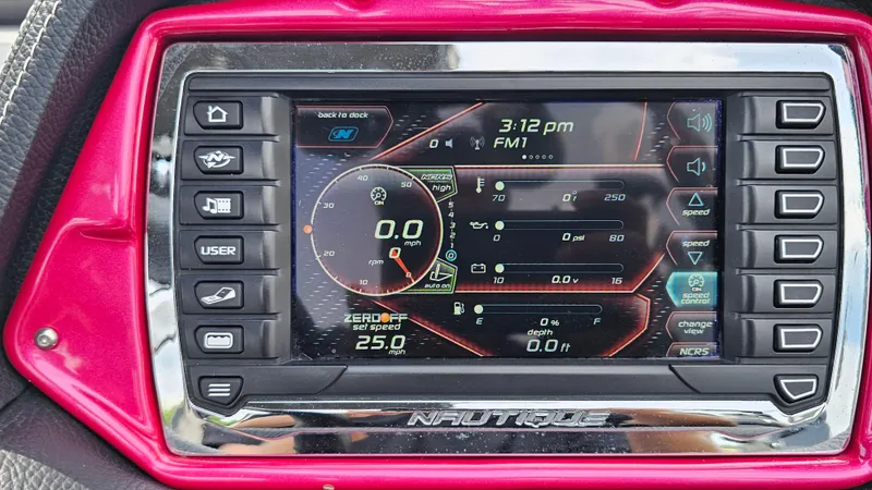 Slide: The Image of Dashboard of a 2015 Nautique Super Air G23 boat with digital controls. - 22