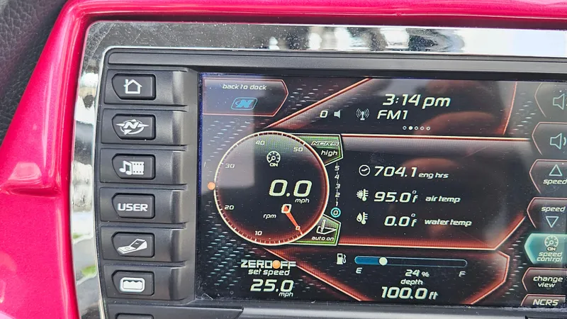 Slide: The Image of Dashboard of a 2015 Nautique Super Air G23 boat showing speed and engine data. - 23