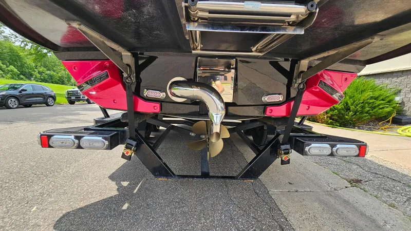 Slide: The Image of Rear view of 2015 Nautique Super Air G23 boat with visible propeller and trailer. - 6