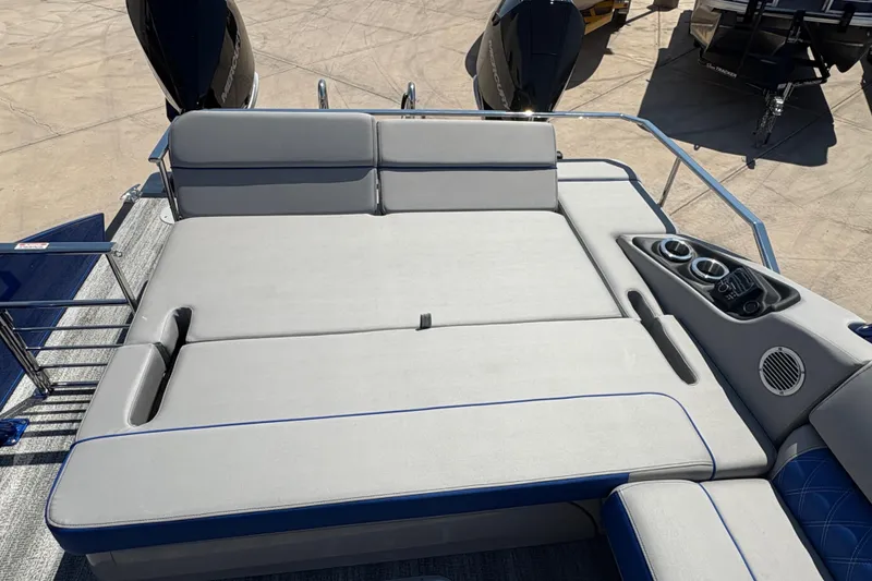 Slide: The Image of 2026 Bennington 27 RXSBAT2 boat with spacious sun deck and cup holders. - 5