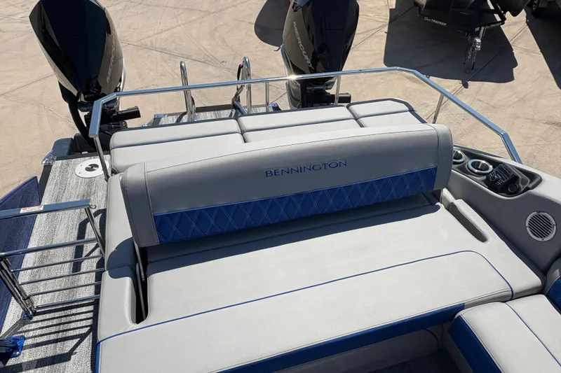 Slide: The Image of 2026 Bennington 27 RXSBAT2 boat with luxurious seating and dual outboard motors. - 7