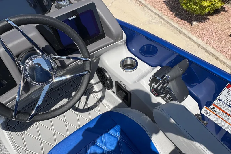 Slide: The Image of Steering wheel and controls of 2026 Bennington 27 RXSBAT2 boat, featuring modern design elements. - 8
