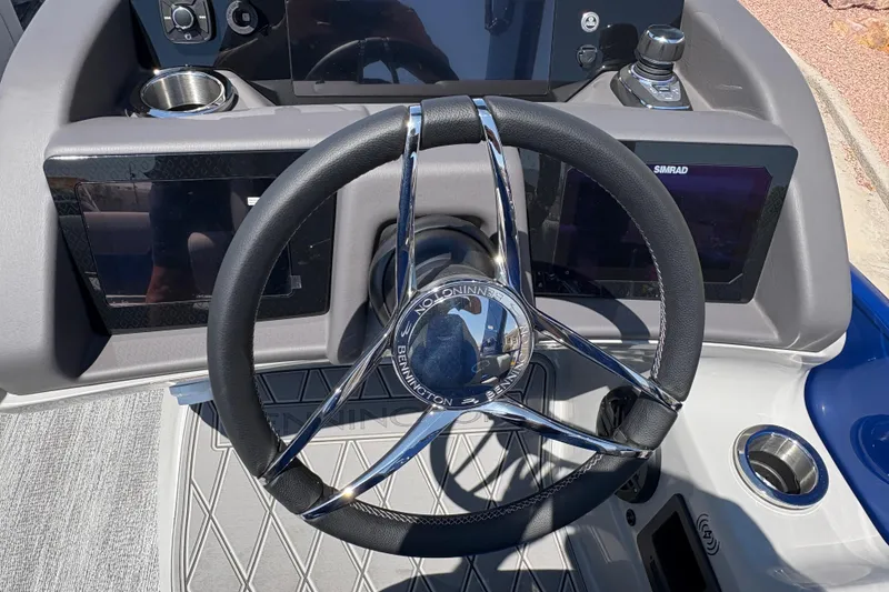 Slide: The Image of Steering wheel of 2026 Bennington 27 RXSBAT2 boat with dual Simrad displays. - 9