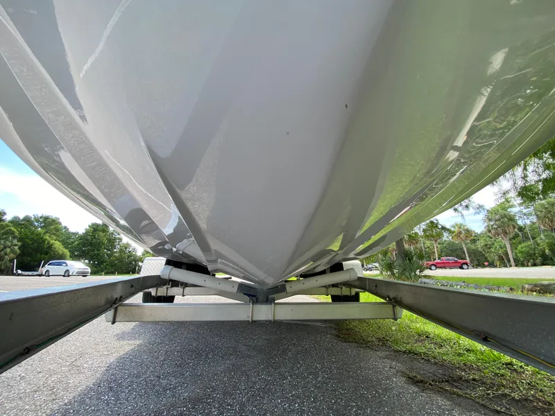 Slide: The Image of 2023 Action Craft 1720 Flats Gen 3 boat hull on trailer, viewed from below. - 10