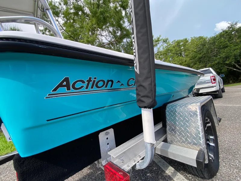 Slide: The Image of 2023 Action Craft 1720 Flats Gen 3 boat on trailer, vibrant blue hull. - 14