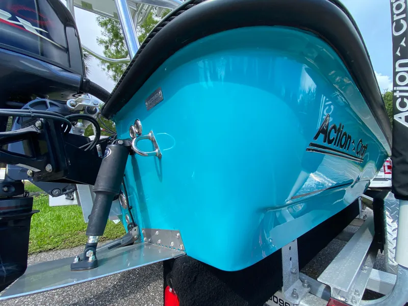 Slide: The Image of 2023 Action Craft 1720 Flats Gen 3 boat, vibrant blue hull, close-up view. - 16