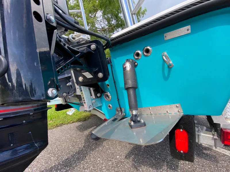 Slide: The Image of 2023 Action Craft 1720 Flats Gen 3 boat transom with motor mount and trim tabs. - 17